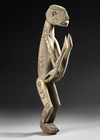 Asmat ancestor carving in heavy wood.