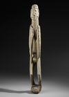 Asmat ancestor carving in heavy wood.