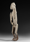 Asmat ancestor carving in heavy wood.