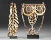 Two breast ornaments/pectorals. The one with the crocodile teeth comes from the Jolika