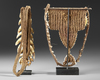 Two breast ornaments/pectorals. The one with the crocodile teeth comes from the Jolika