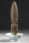 Borneo Dayak Hampatong figure in a 19th century copy of a Song bowl.