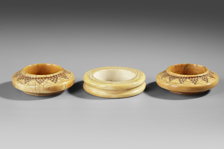 Sumba. Pair of ivory bracelets. Probably 19th century. And another ivory bracelet from Indonesia. From the collection of Jac Hoogerbrugge.