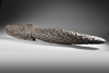 Large Asmat neckroll with ancestor heads, praying mantis and other headhunting motifs.