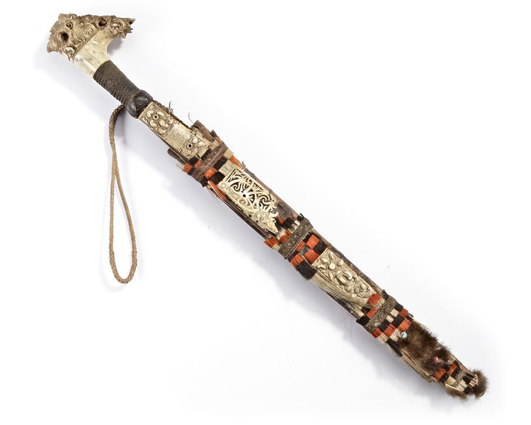 Dayak Mandau. Decorated with bone panels and fur. From the collection of Jac Hoogerbrugge.