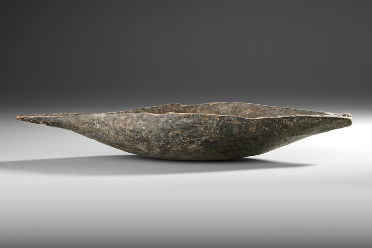 Asmat. Well used and delicately carved bowl.