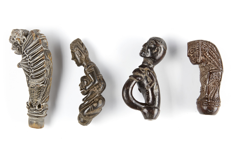 Four kris, machete, sword or betel nut crusher handles. Collected by Jac Hoogerbrugge in the 1960’s and 1970’s.