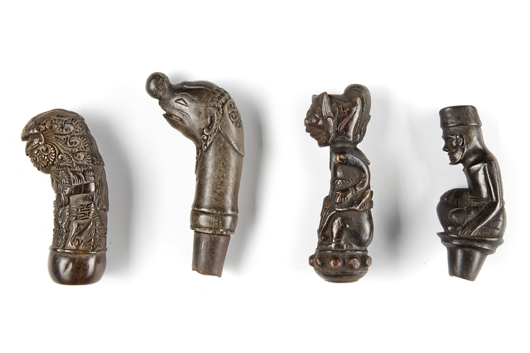 Four kris, machete, sword or betel nut crusher handles. Collected by Jac Hoogerbrugge in the 1960’s and 1970’s.