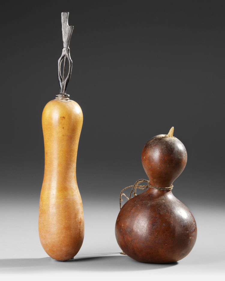 Two old and well used gourd lime containers with lick sticks/spatulas. Collected by Jac Hoogerbrugge in the 1950’s.