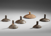 Six old and well used Anelam spinning tops. Ceremonial toys.