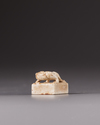 A Chinese chicken bone jade square seal