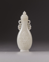 A small Chinese white jade flattened baluster vase and cover