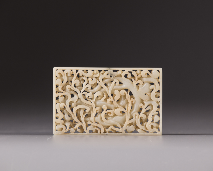 A white jade openwork ‘dragon’ plaque