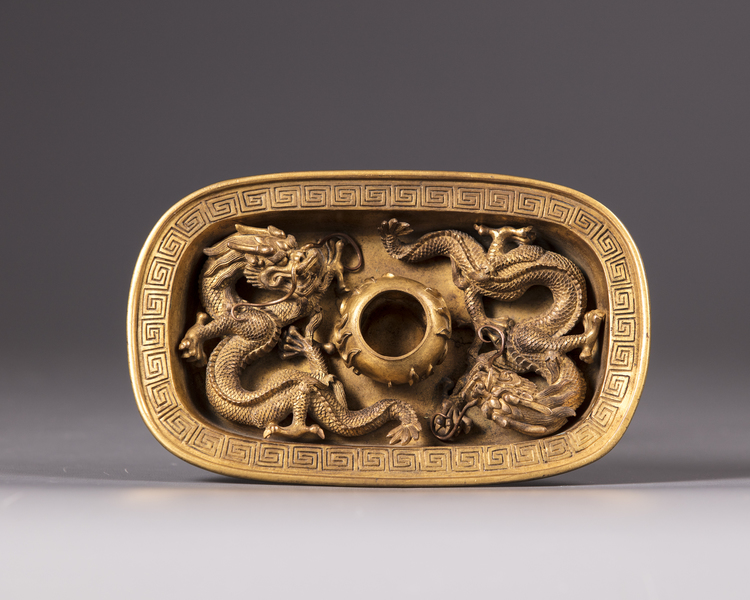A Chinese gilt bronze 'dragon' drip pan
