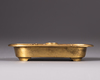 A Chinese gilt bronze 'dragon' drip pan