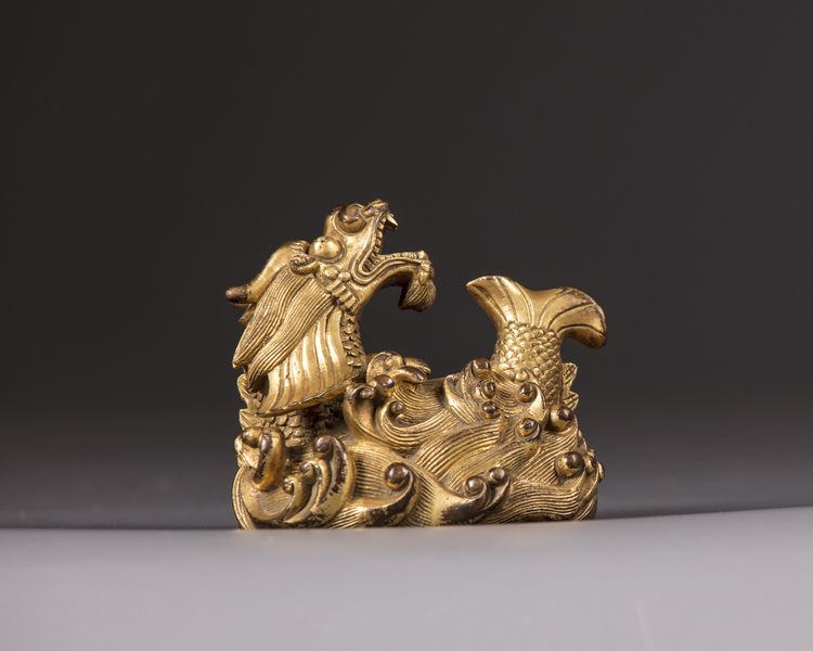 A Chinese gilt bronze 'dragon carp' paperweight