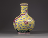 A Chinese yellow-ground octagonal famille rose 'dragon' bottle vase
