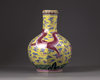 A Chinese yellow-ground octagonal famille rose 'dragon' bottle vase