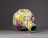 A Chinese yellow-ground octagonal famille rose 'dragon' bottle vase