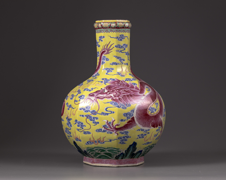 A Chinese yellow-ground octagonal famille rose 'dragon' bottle vase