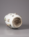 A Chinese famille rose moulded and appliqué 'precious objects' rouleau vase