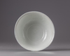 A Chinese Shufu-style white-glazed moulded 'dragon' bowl
