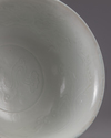 A Chinese Shufu-style white-glazed moulded 'dragon' bowl