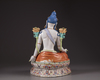 A Chinese famille rose figure of Avalokitesvara on a double lotus base