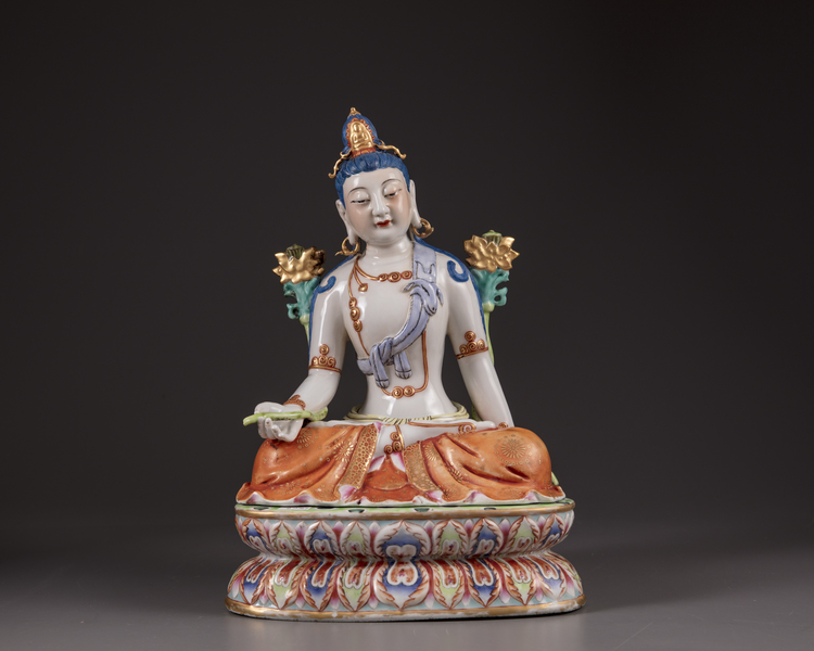 A Chinese famille rose figure of Avalokitesvara on a double lotus base