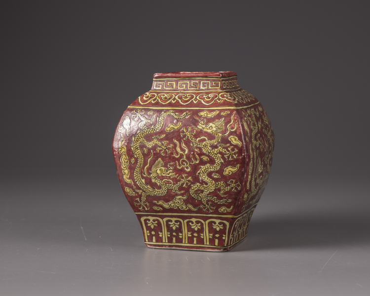 A  copper-red square-shaped vase