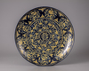A large Chinese blue-ground yellow-enamelled 'dragon and crane' charger