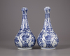 A pair of Chinese moulded blue and white 'Kraak' garlic neck vases