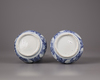 A pair of Chinese moulded blue and white 'Kraak' garlic neck vases