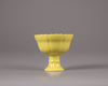 A Chinese yellow glazed stem cup