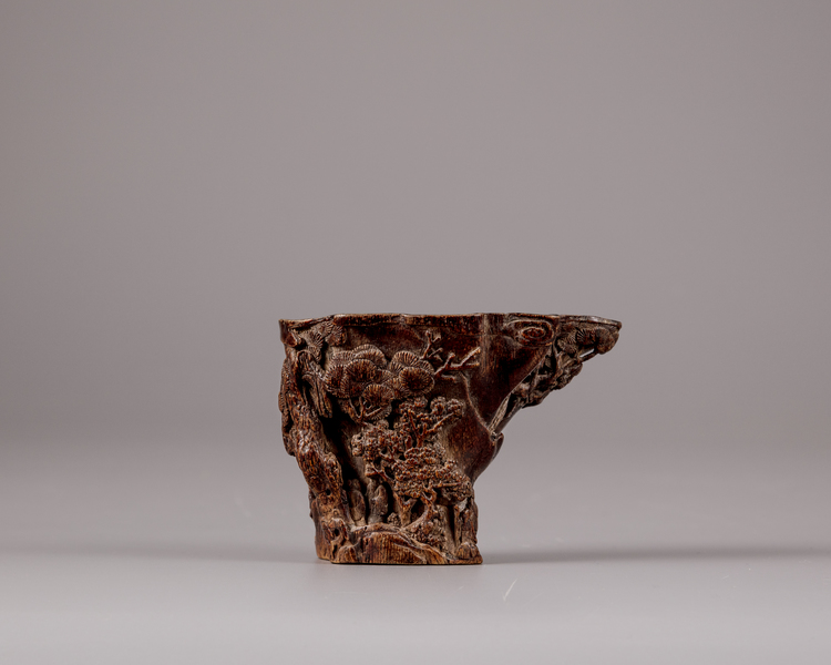 A Chinese aloeswood 'scholar and pine' libation cup