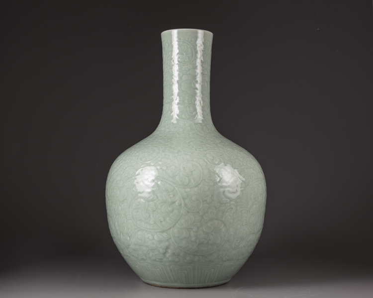 A large Chinese celadon-glazed moulded bottle vase