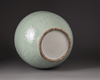 A large Chinese celadon-glazed moulded bottle vase