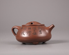 A Chinese yixing tripod teapot and cover