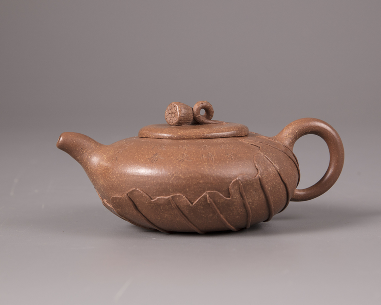 A Chinese yixing 'lotus-leaf' teapot and cover