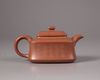 A Chinese yixing slip-decorated teapot and cover