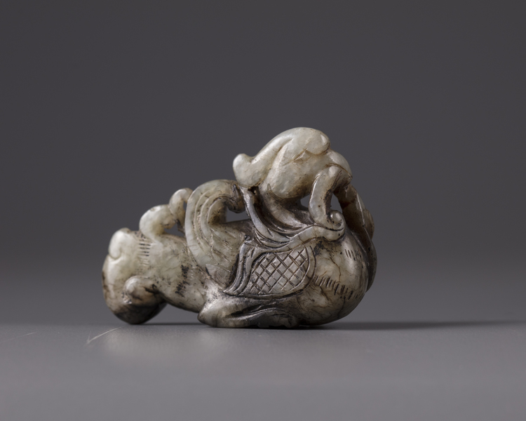 A Chinese pale celadon jade 'mandarin duck and lotus' carving
