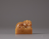 A Chinese yellow soapstone 'tiger' seal