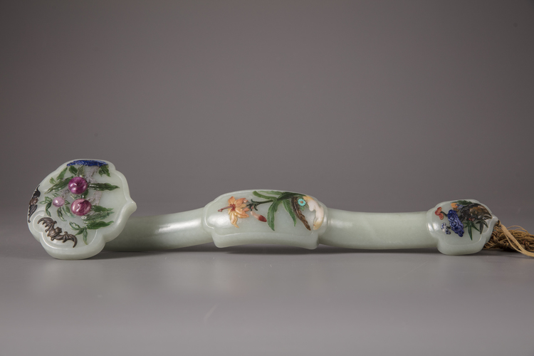 A Chinese hardstone-inlaid pale celadon jade ruyi sceptre
