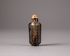 A Chinese smokey-quartz hexagonal inscribed snuff bottle