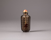 A Chinese smokey-quartz hexagonal inscribed snuff bottle