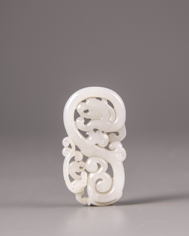 A Chinese white jade 'twin dragon' plaque
