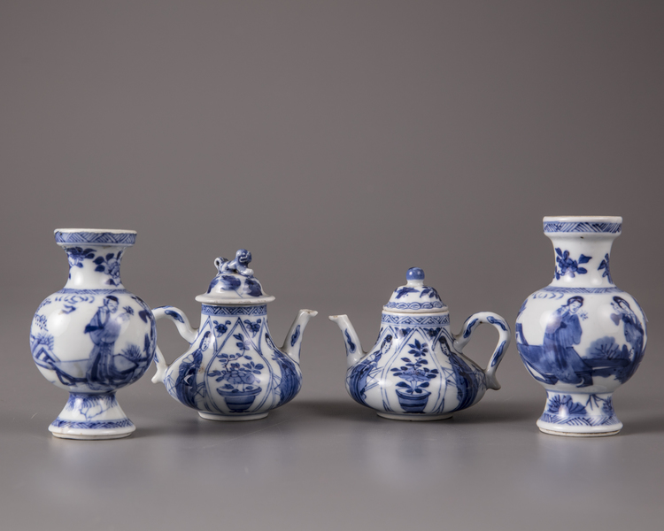 Two pairs of Chinese blue and white miniature vases and teapots