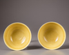 A pair of Chinese yellow-glazed ‘dragon’ bowls