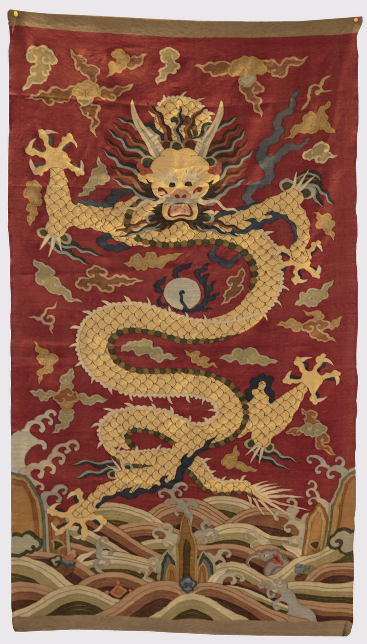 A Chinese red-ground kesi 'dragon' panel