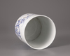 A Chinese blue and white and underglaze red brush pot, bitong